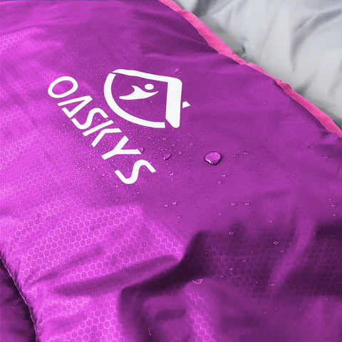 Close-up of waterproof purple All Season Camping Sleeping Bag for Adults and Kids, Lightweight and Warm in 10 to 20 Degrees Celsius.