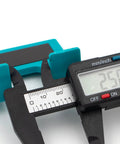 Close-up of Easy Hinge Mate Quick Door Hinge Jig For Precise 2mm Alignment with digital caliper showing measurement