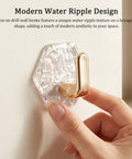 Pack Of 8 Hexagonal Water Ripple Self Adhesive Wall Hooks Silver No Drill Heavy Duty Storage Snag Your Gear Simple Peel Mount Bathroom Kitchen Towel Robe Coats Holders, close-up showing modern design.