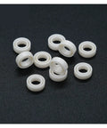 Premium MR74 4x7x2.5 Millimeter Full Ceramic Zirconia Sealed Ball Bearing set on black background.