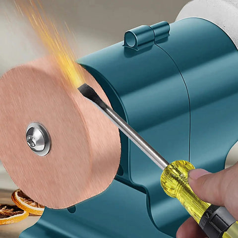 Kickass Compact Cordless Bench Grinder Featuring A Beefy 21V Motor, user sharpening tool with sparks on copper wheel.