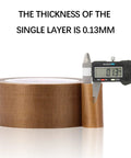 Nonstick PTFE Glass Cloth Tape Five Mil Thick Three Quarters Inch Wide Thirty Three Yards with digital caliper showing 0.13mm thickness.