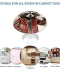 2 Pack Super Slick Red Raccoon Painted Drawer Knobs With Hella Tough 1.1 Inch Stainless Steel Base shown on cabinet doors.