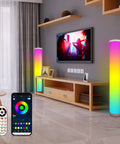 Two Pack RGB Floor Lamps With Music Sync App Control and TV in living room setup displaying vibrant colors