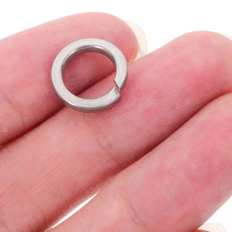 Stainless Steel M8 Spring Lock Washers Set 100 Pieces Split Locking Washers For Screws And Bolts Pro Grade DIY Gear For Industrial And Home Use With Heavy Duty Security And Vibration Resistance, M8 washer held in hand