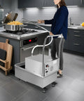 Heavy Duty Commercial Fryer Oil Filter Machine With Cart 55L Stainless Steel Storage Tank 550W Motor in kitchen.