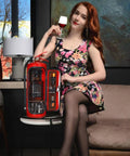 Fire Extinguisher Mini Bar With Concealed Liquor Cabinet To Stash Your Top Shelf Booze, stylishly displayed with a woman holding a drink.