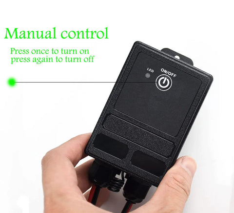 Manual control on Beefy Waterproof Wireless Relay Switch For Outdoor Lighting With Long Range RF Remote, shown in hand