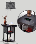 Madison Compact Side Table With Integrated Floor Lamp USB Port And LED Bulb in black with charging phone displayed