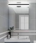Bathroom setting with Dope Sleek Black Vanity Light 23.6 Inch LED Up and Down Fixture With Frosted White Acrylic Diffusers above mirror.