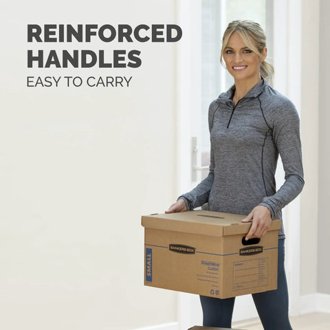 Woman carrying Ten Pack Of Medium Moving Boxes Built Tough With Reinforced Handles No Tape Assembly Required Easy To Pack And Stack.