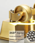 Close-up of Top Shelf Solid Brass Casters delivering three sixty degree swivel grace with polished gold finish.