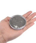 Hella Smooth 4Mm 304 Stainless Steel Ball Bearings G100 Precision Grade in hand, showing package of two hundred metal balls.