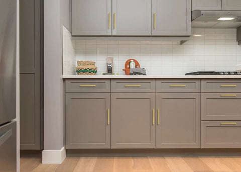 Solid Brushed Gold Square Cabinet Pulls Six Quarter Inches Center To Center on gray kitchen drawers with countertop decor.