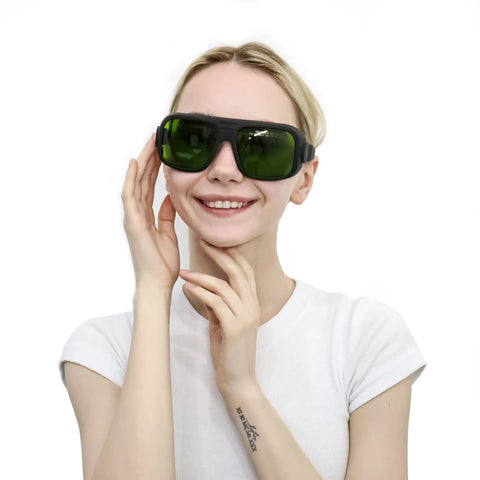 Pro Grade Laser Safety Goggles For Medical Spas And Hair Removal With Rock Solid OD6 OD7 Shield Against 808 980 1064Nm Diode Lasers CE EN207 Certified Lightweight Unisex fit worn by smiling woman.