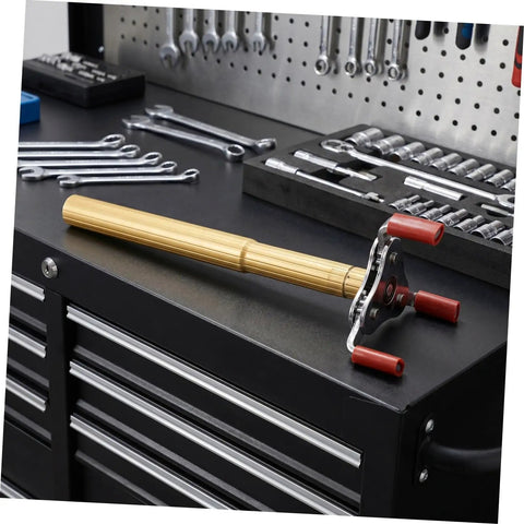 Smoke Sensor Removal Tool With Claw Head Attachment For Ceilings Hassle Free Fire Detector Extraction Safe For Delicate Alarms on a workbench.