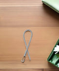 Foldable Drawstring Threaders Kit With Latch Hook 20 Pieces DIY Rope Threader Set for hoodies on wooden background.