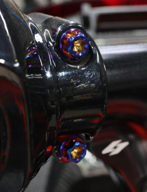 Top Shelf Titanium Handlebar Clamp Bolts And Brake Clutch Perch Screws For Heavy Duty Motorcycles, close-up view of colorful titanium fasteners.