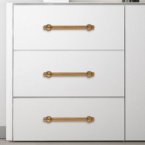 10 Pack 5 Inch Antique Brass Cabinet Pulls Solid Zinc Alloy Drawer Handles on white dresser drawers.