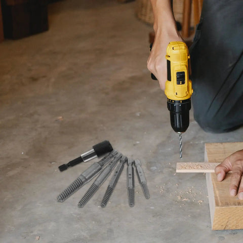 Screw Extractor Kit Helps You Pull Broken Stripped Bolts With Ease, Heavy Steel Drill Bits In #1 To #5 Sizes Perfect For DIY Home Repairs And Tough Jobs, Super Durable Tool That Saves Your Day. hand using drill with steel extractor bits on floor