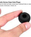 Hand holding 8 Pack T Shaped Silicone Plug 19mm Three Quarters Inch Dia Round Rubber Stopper in black