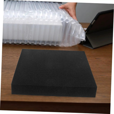Four Pack Heavy Duty Polyurethane Foam Sheets High Density Cushioning For Toolboxes And Vehicle Cases Hella Durable Stain Absorbing Cleaning Pads on a wooden table.