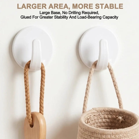 Two Eight Piece White Peel And Stick Wall Hooks displayed with woven bag and wooden spoon, demonstrating strong adhesive hold.