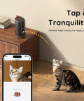Cat interacting with 2K Pet Cam With Treat Dispenser And AI Photo Album; remote treat tossing feature shown on phone app.