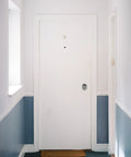 Slick Hidden Door Handle Featuring One Sided Deadbolt Lock European Style Luxury Bedroom Privacy Latch Straight Up Solid Black Build For A Sweet Smooth Operation on white door.