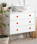 Top Shelf Red Happiness Round Cabinet Knobs Featuring A Slick Vintage Oil Paint Finish Hella Sturdy Rust Resistant Zinc Alloy Drawer Pulls Single Hole Mount Center Pack Of Four For Kitchen And Bedroom Cabinets on a white dresser.