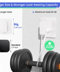 Heavy Duty Adhesive Wall Hooks That Hold Like A Champ, zero hassle no sweat mounting for showers and kitchens, waterproof rustproof sticky wall hangers with a grippy fit, kickin performance set of six white showing larger size and load capacity 22 Lbs.