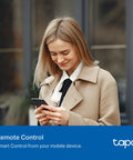 Woman using Smooth Hand Swipe Dimming Four Pack Wi Fi Light Knob in beige coat for remote control via mobile.