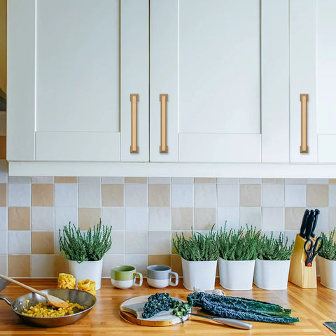 Kitchen with 5 Pack 5 Inch Gold Cabinet Handles Champagne Bronze Kitchen Cabinet Pulls installed on white cupboards.