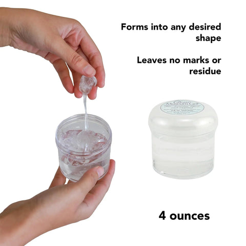 Person holding Clear Museum Gel Adhesive For Securing Collectibles And Decor Removable And Reusable Non Toxic Formula 4 oz container