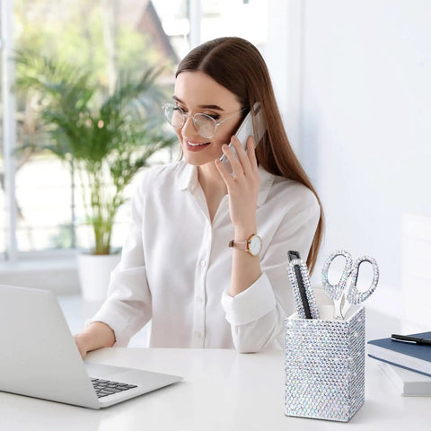 Woman using laptop with Blinged Out Desk Accessories Set Seven Piece Office Glam Kit With Diamond Tape Dispenser on desk