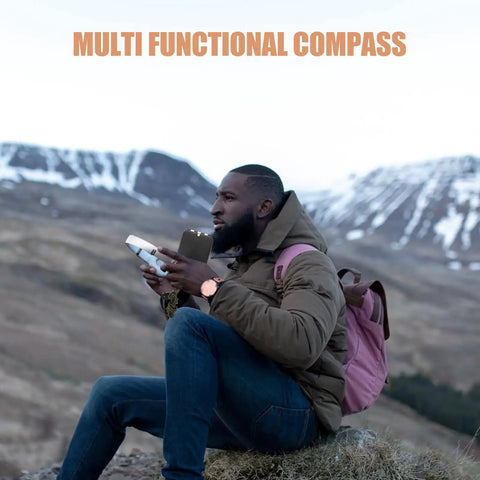 Person holding Multifunctional Outdoor Hiking Compass With Scale And Luminous Mirror For Camping in mountain landscape