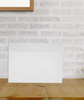 A4 Gray White Self Sealing Paper Mailing Envelopes Thickened For Documents And Photos 30 Pack on wooden table with brick background