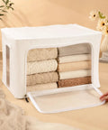 2 Pack Large Capacity Cotton Linen Storage Bags For Sweaters And Bulky Knits Breathable Garment Organizers displaying neatly folded blankets in a white storage bag.