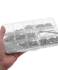 Hand holding Stainless Steel Shower Panel Screw Kit 400 Piece Assortment With Small Self Tapping Screws in a clear box