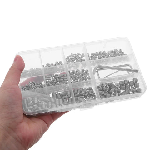 Hand holding Stainless Steel Shower Panel Screw Kit 400 Piece Assortment With Small Self Tapping Screws in a clear box