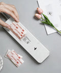 Badass Dual Lock Fastener 12 Pack Heavy Duty Mounting Tape 1 X 2 Inches clear strips being applied to an object.