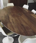 Top Shelf Rustic Walnut Brown Oxidizing Wood Stain For Aging And Weathering Furniture Boards With Rich Tannin Reactive Finish For Authentic Patina Looks On Any Front Porch DIY Project on a modern oval dining table.