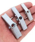 Three carbon steel toggle bolts from 48 Piece Heavy Duty Drywall Anchors Toggle Bolt And Wing Nut Kit in a hand