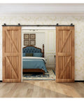 Built Tough Barn Door Hardware Kit 4 Foot Sliding Rail System Double Wood Doors installed in a bedroom doorway.