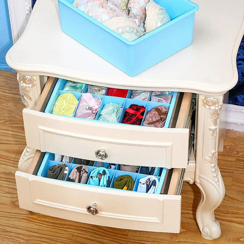 3 Piece Blue Plastic Underwear Storage Set Featuring 10 And 15 Cell Vertical Drawers, organized lingerie in stacked drawers.
