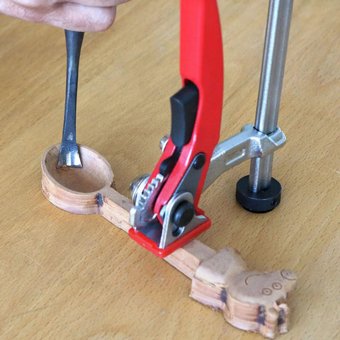 User demonstrating Heavy Duty Ratchet Hold Down Clamp delivering dead nuts secure grip on a twenty millimeter base for woodworking.