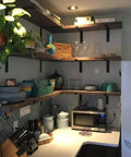 Heavy Duty Industrial Floating Shelf Wall Brackets For True 10 Inch Lumber Boards supporting kitchen shelves with dishes and glassware.