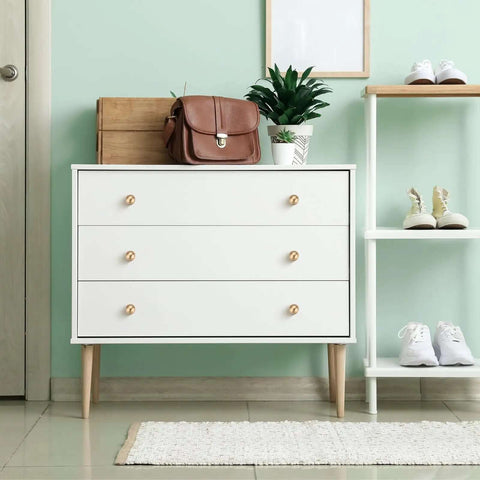 Level Up Your Decor With Slick Champagne Bronze Cabinet Knobs 24 Pack Round Dresser Handles Crafted From Heavy Duty Zinc Alloy For A Rock Solid Home Refresh Project on a stylish white dresser.