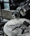 Built Tough Adjustable Clutch Fork Alignment Sleeve Socket Wrench next to keys on a wooden table in a workshop.