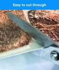 Close-up of cutting 3D Faux Stone Wall Panels Non Adhesive PVC Covering 50 Sq Ft For Home And Office Decor, 10 Pack with scissors.